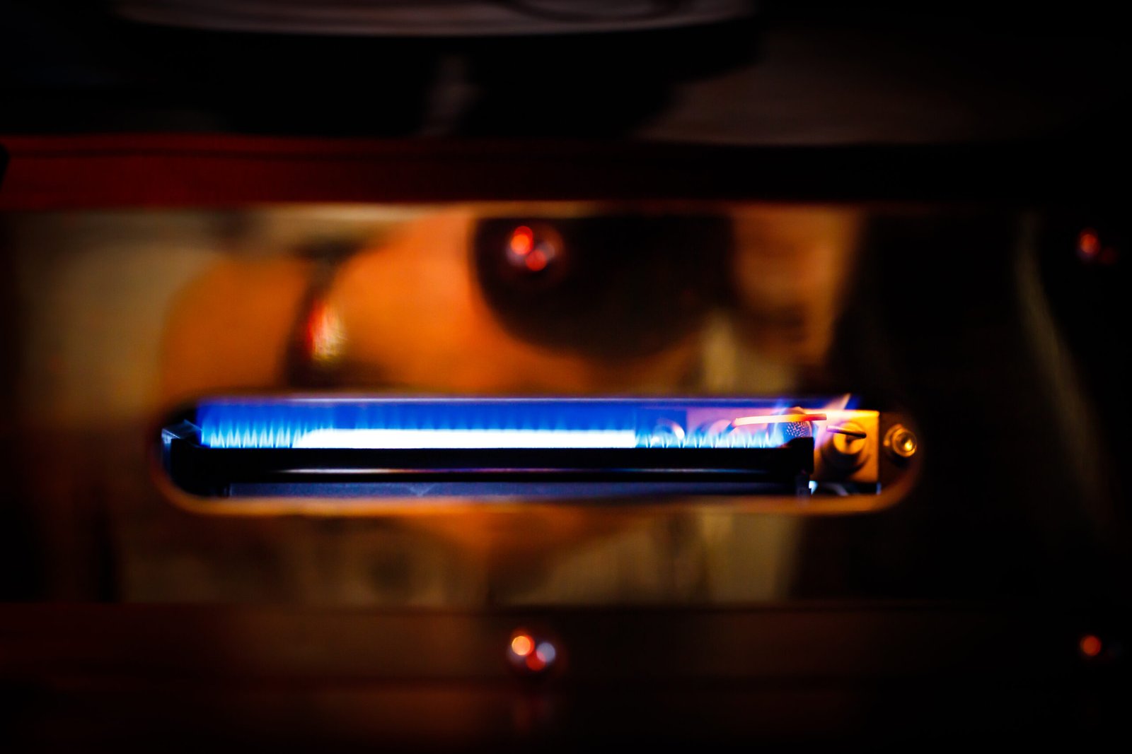 Gas boiler igniter. Gas is burning in the boiler.